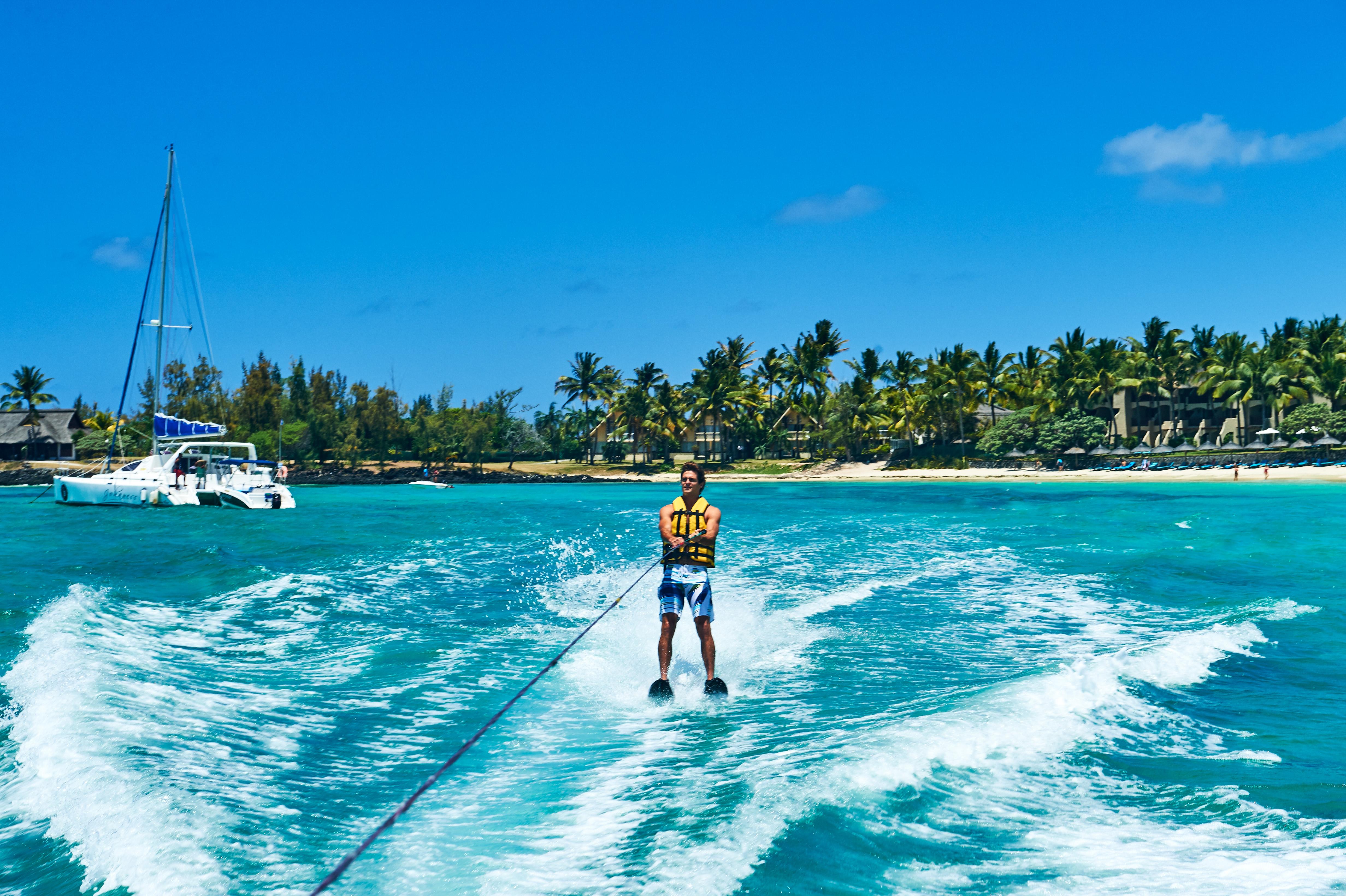 Constance Belle Mare Plage Exterior photo A man waterskiing in Bermuda